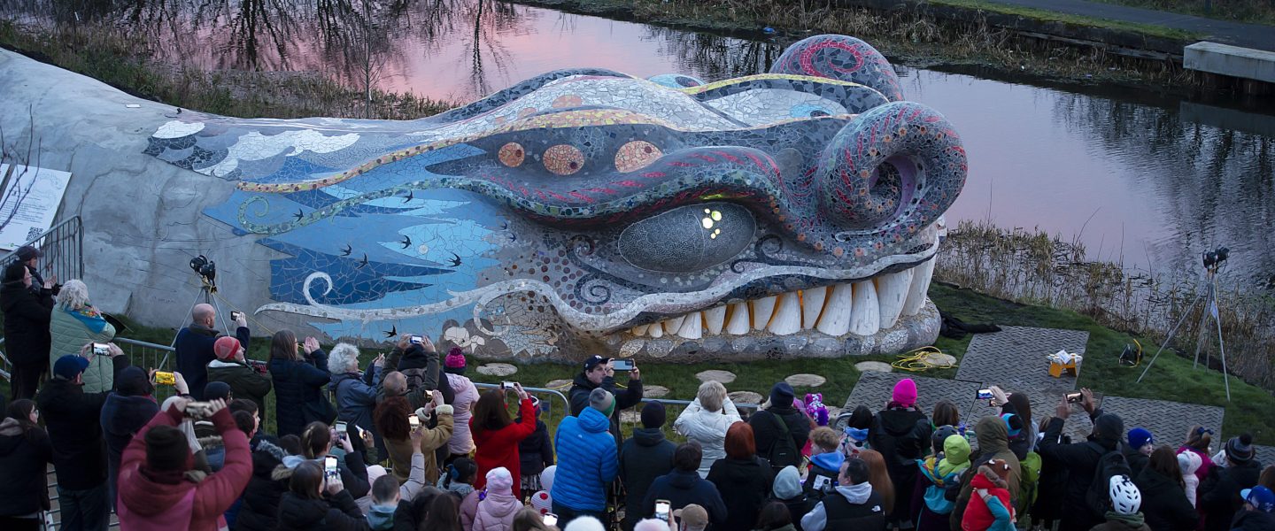 Opening of Blethir at Stockingfield Bridge, Fort & Clyde Canal, Glasgow.

The headpiece of Scotlandís largest community mosaic art project has been unveiled today 1st March 2024 in North Glasgow.
The Kelpiesí cousin, The Beithir, slithered into the city in September 2023, marking a major milestone in Scottish Canalsí Stockingfield Bridge community artwork project.

The 121-metre mythical serpent in Scottish folklore, now forms the centrepiece of one of 22 artworks commissioned by Scottish Canals for the parkland that surrounds the new active travel bridge. The Beithir or ìBella and the seven windsî is an artwork by Scottish artist Nichol Wheatley.

More info from Shirley.Bartynek@scottishcanals.co.uk
07768458442